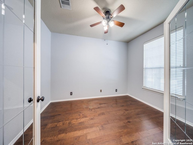 520 Foxford Run Dr, Schertz, TX 78108 - unfurnished room with dark wood finished floors, ceiling fan, and baseboards