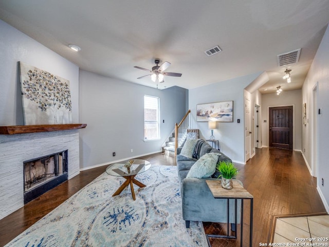 520 Foxford Run Dr, Schertz, TX 78108 - living area with stairway, baseboards, wood finished floors, and a ceiling fan