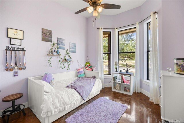 122 Twisting Oaks Ct, Pipe Creek, TX 78063 - bedroom featuring concrete flooring, baseboards, and a ceiling fan