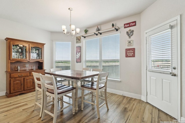 402 Devnet, Cibolo, TX 78108 - dining room with a chandelier, light wood-style floors, and baseboards
