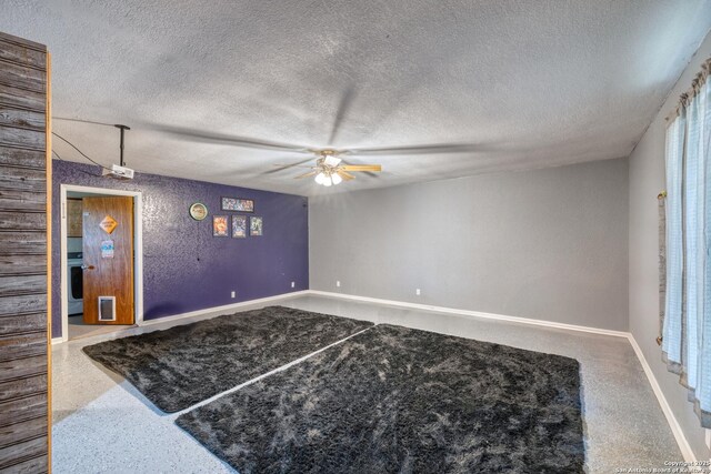 105 S Bluebonnet, Uvalde, TX 78801 - spare room featuring ceiling fan, a textured ceiling, and baseboards