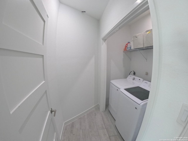 524 Flaman, Canyon Lake, TX 78133 - laundry room with separate washer and dryer and light wood-type flooring