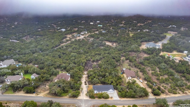 524 Flaman, Canyon Lake, TX 78133 - view of property location with a heavily wooded area
