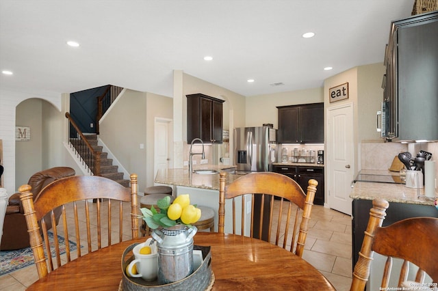 1989 Kalli Jo, New Braunfels, TX 78130 - dining area with light tile patterned floors, stairway, recessed lighting, and arched walkways