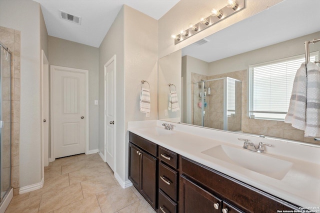 1989 Kalli Jo, New Braunfels, TX 78130 - bathroom with a stall shower, double vanity, baseboards, and tile patterned floors