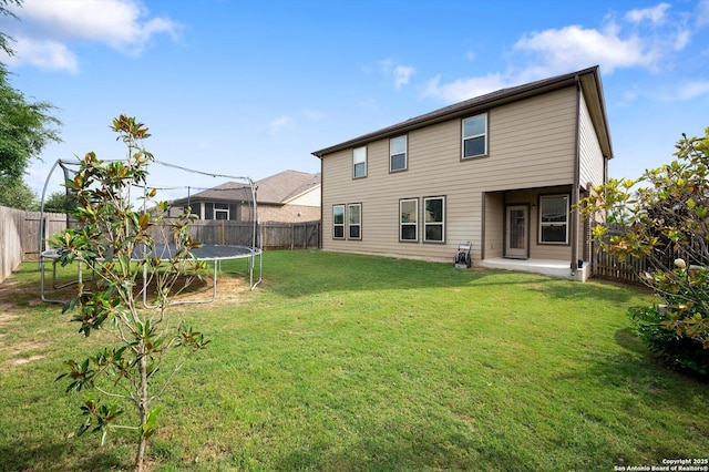 1989 Kalli Jo, New Braunfels, TX 78130 - back of property featuring a trampoline and a patio area