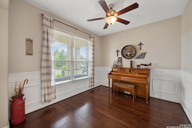 1989 Kalli Jo, New Braunfels, TX 78130 - living area with a wainscoted wall, wood finished floors, a ceiling fan, and a decorative wall