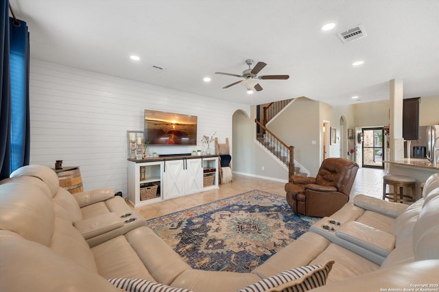 1989 Kalli Jo, New Braunfels, TX 78130 - living room featuring arched walkways, stairway, ceiling fan, light tile patterned flooring, and recessed lighting