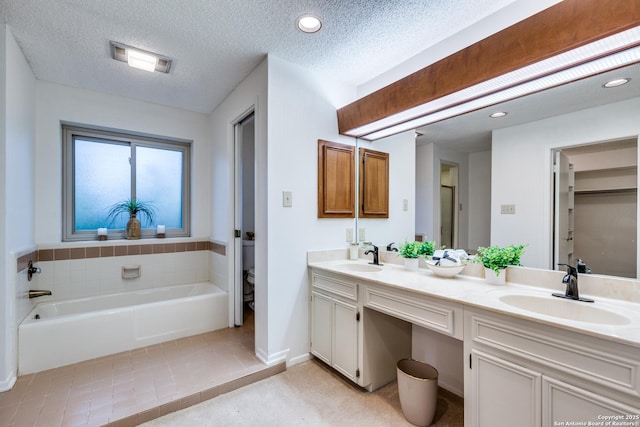 16930 Hidden Timber Wood, San Antonio, TX 78248 - full bath featuring double vanity, a bath, tile patterned floors, toilet, and recessed lighting