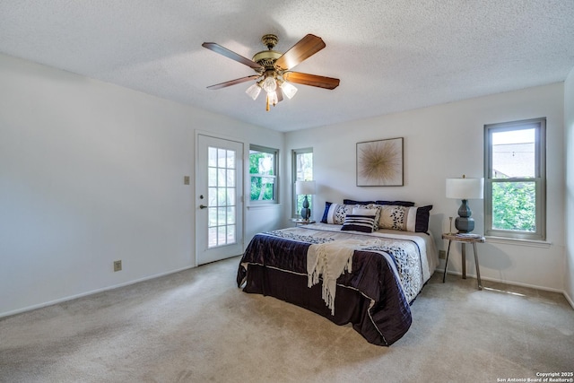 16930 Hidden Timber Wood, San Antonio, TX 78248 - bedroom with carpet, access to exterior, a textured ceiling, a ceiling fan, and baseboards