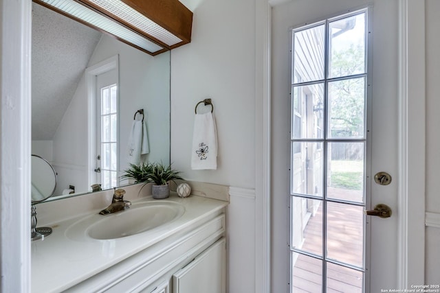 16930 Hidden Timber Wood, San Antonio, TX 78248 - bathroom with vaulted ceiling and vanity
