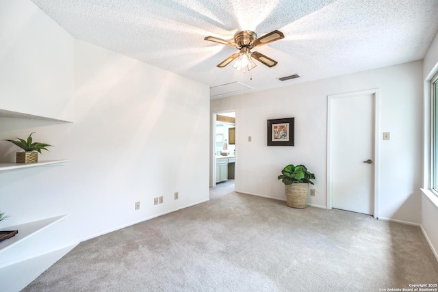 16930 Hidden Timber Wood, San Antonio, TX 78248 - carpeted spare room with ceiling fan, attic access, a textured ceiling, and baseboards