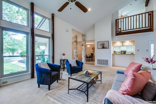 16930 Hidden Timber Wood, San Antonio, TX 78248 - living area featuring high vaulted ceiling, light carpet, plenty of natural light, a ceiling fan, and baseboards