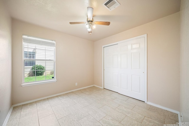 7731 Cedar Farm, San Antonio, TX 78239 - unfurnished bedroom featuring baseboards, a closet, ceiling fan, and light tile patterned floors