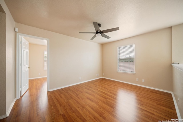 7731 Cedar Farm, San Antonio, TX 78239 - spare room with ceiling fan, plenty of natural light, wood finished floors, and baseboards