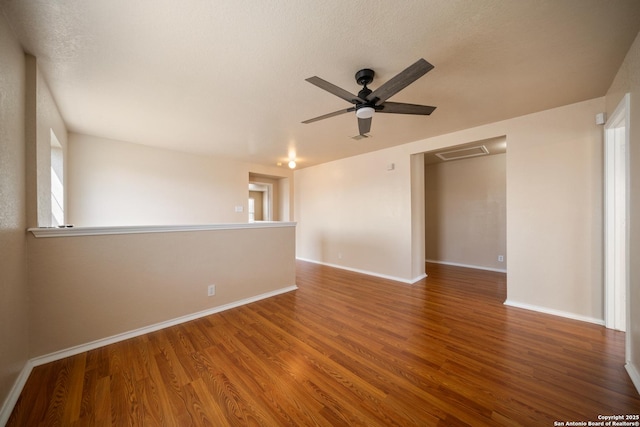 7731 Cedar Farm, San Antonio, TX 78239 - spare room featuring wood finished floors, a ceiling fan, and baseboards