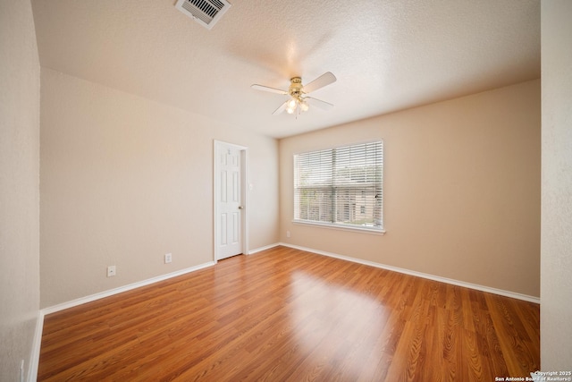 7731 Cedar Farm, San Antonio, TX 78239 - spare room with a ceiling fan, wood finished floors, and baseboards