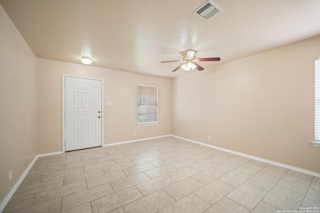 7731 Cedar Farm, San Antonio, TX 78239 - unfurnished room with ceiling fan, light tile patterned flooring, healthy amount of natural light, and baseboards