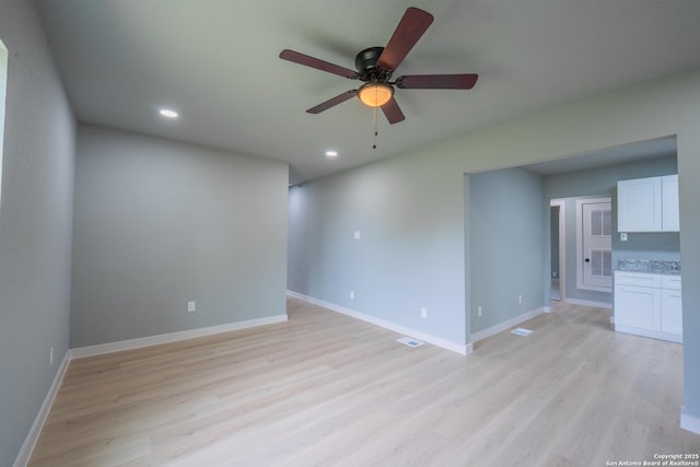 234 Gaiety Ln, Kirby, TX 78219 - unfurnished living room with light wood-type flooring, a ceiling fan, recessed lighting, and baseboards