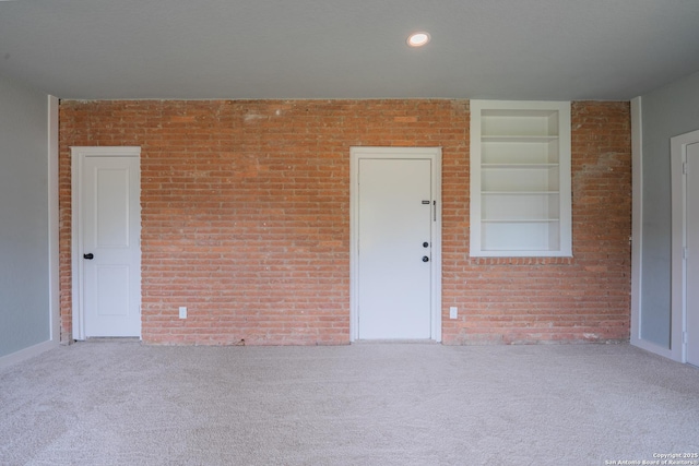 234 Gaiety Ln, Kirby, TX 78219 - carpeted spare room featuring built in shelves