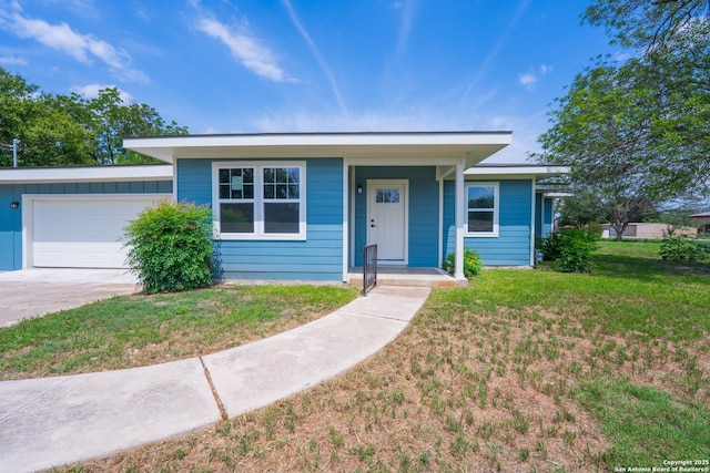 234 Gaiety Ln, Kirby, TX 78219 - view of front of home featuring a garage, a front lawn, and driveway