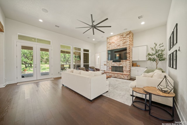 117 Sabella, Spring Branch, TX 78070 - living area featuring a ceiling fan, a fireplace, dark wood finished floors, recessed lighting, and french doors