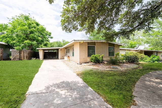 435 Sharon, San Antonio, TX 78216 - ranch-style home with driveway, brick siding, and an attached carport