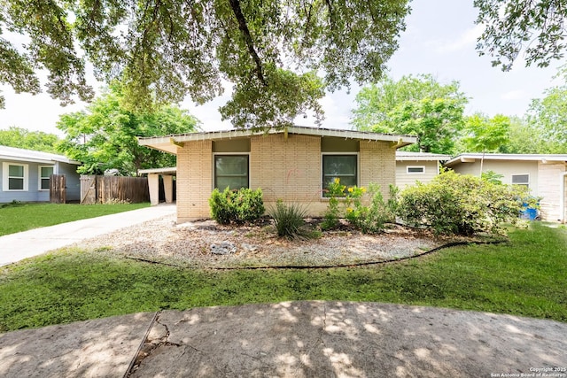 435 Sharon, San Antonio, TX 78216 - view of front of property with brick siding, driveway, and a carport