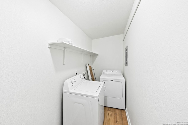 435 Sharon, San Antonio, TX 78216 - laundry area with separate washer and dryer, light wood-style flooring, and electric panel