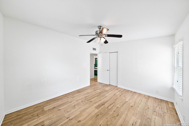 435 Sharon, San Antonio, TX 78216 - unfurnished bedroom featuring light wood finished floors, a closet, baseboards, and a ceiling fan