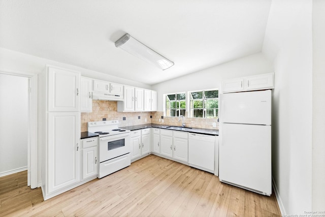 435 Sharon, San Antonio, TX 78216 - kitchen with white appliances, under cabinet range hood, a sink, white cabinetry, and vaulted ceiling