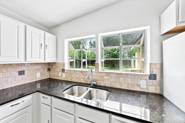 435 Sharon, San Antonio, TX 78216 - kitchen featuring a sink, white cabinetry, backsplash, and dark stone counters
