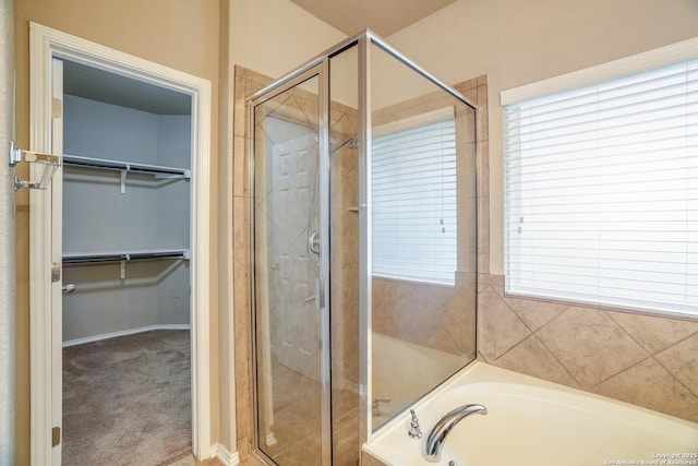 6763 Indian Ldg, San Antonio, TX 78253 - full bath with a shower stall, a spacious closet, a garden tub, and plenty of natural light