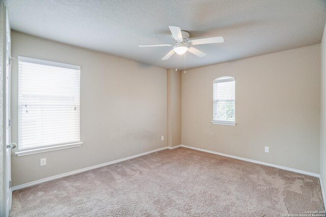 6763 Indian Ldg, San Antonio, TX 78253 - carpeted spare room with ceiling fan, baseboards, and a textured ceiling