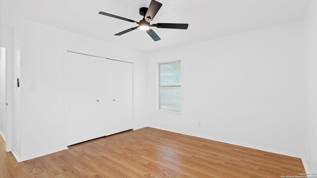 218 Gruene, New Braunfels, TX 78130 - unfurnished bedroom featuring light wood-style flooring, a closet, and ceiling fan