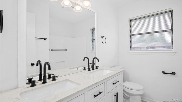 218 Gruene, New Braunfels, TX 78130 - bathroom featuring toilet and double vanity