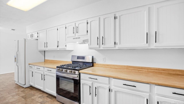 218 Gruene, New Braunfels, TX 78130 - kitchen featuring stainless steel gas range oven, under cabinet range hood, refrigerator with ice dispenser, and light countertops