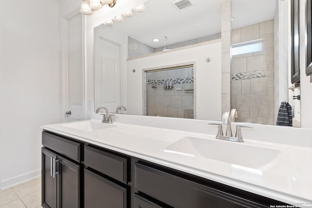 13917 Westbury Fls, San Antonio, TX 78253 - full bathroom featuring double vanity, tiled shower, and tile patterned flooring