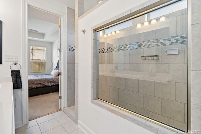 13917 Westbury Fls, San Antonio, TX 78253 - ensuite bathroom featuring tile patterned flooring, tiled shower, and a tray ceiling