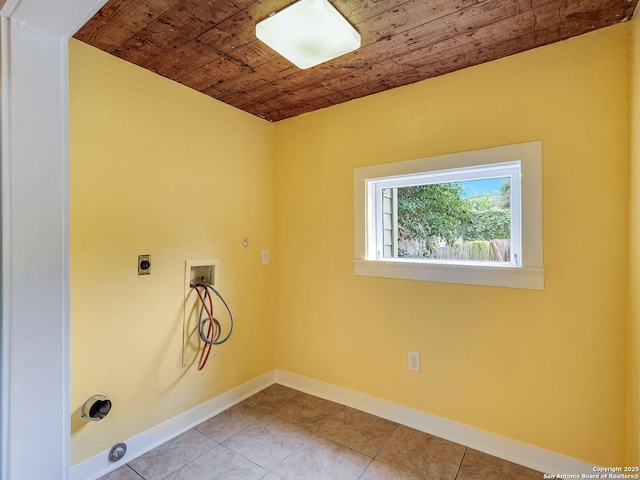1211 W Magnolia Ave, San Antonio, TX 78201 - laundry area with wooden ceiling, electric dryer hookup, washer hookup, baseboards, and tile patterned flooring