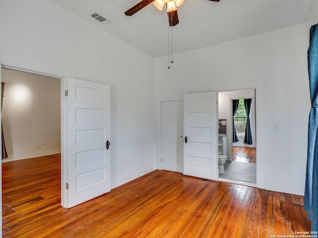 1211 W Magnolia Ave, San Antonio, TX 78201 - unfurnished bedroom featuring hardwood / wood-style floors, baseboards, and ceiling fan