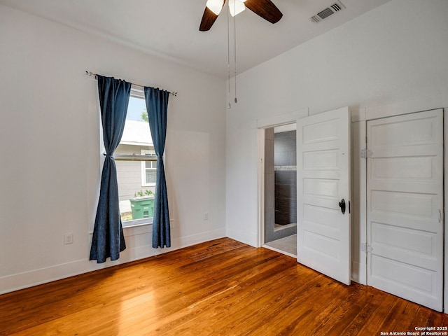 1211 W Magnolia Ave, San Antonio, TX 78201 - unfurnished room with wood finished floors, ceiling fan, and baseboards