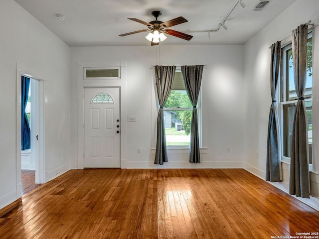 1211 W Magnolia Ave, San Antonio, TX 78201 - foyer entrance with hardwood / wood-style floors, a ceiling fan, baseboards, and rail lighting