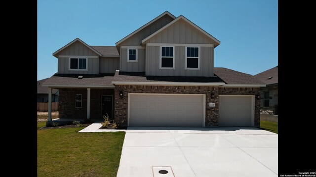 3704 Pin Oak, Seguin, TX 78155 - craftsman inspired home featuring board and batten siding, a front yard, driveway, and a garage