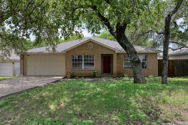 5711 Timberhurst, San Antonio, TX 78250 - ranch-style home featuring a garage, brick siding, and concrete driveway
