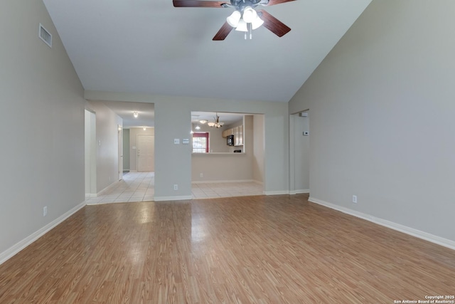 5711 Timberhurst, San Antonio, TX 78250 - unfurnished living room with a ceiling fan, light wood-style flooring, and a chandelier