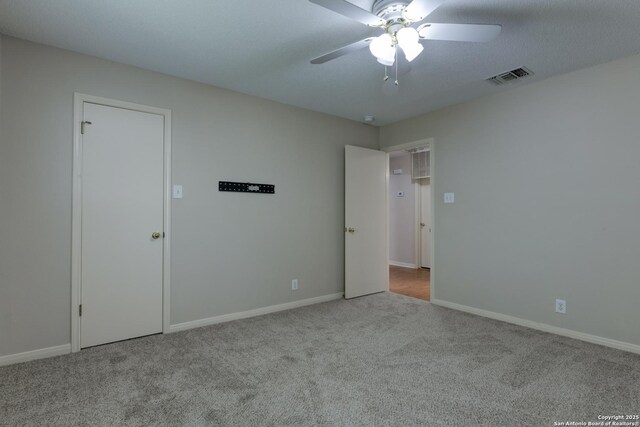 5711 Timberhurst, San Antonio, TX 78250 - unfurnished bedroom with carpet and a ceiling fan