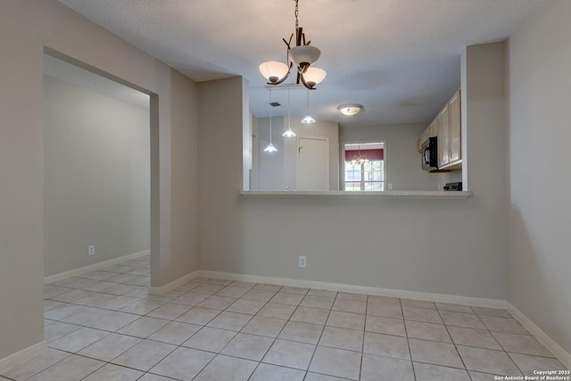 5711 Timberhurst, San Antonio, TX 78250 - spare room with a chandelier and light tile patterned floors