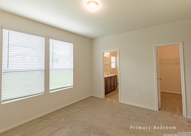 468 Salz Way, San Antonio, TX 78260 - unfurnished bedroom featuring a spacious closet, light carpet, a closet, and ensuite bathroom