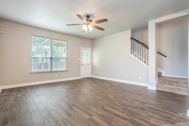 7030 Plains Way, San Antonio, TX 78253 - empty room featuring a ceiling fan, dark wood-style flooring, stairway, and baseboards